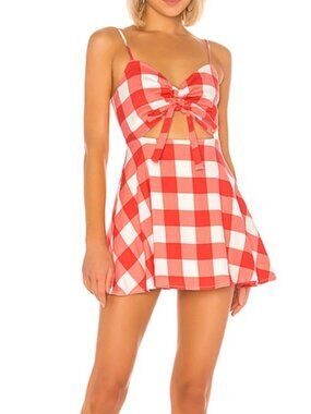The open back with a bow detail adds a playful touch.Mini Dress ♥️Hostess Pick